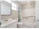 Clean bathroom features a shower-tub combination and accessibility handrails for added safety at 5521 Riverbluff Cir # V-10, Sarasota, FL 34231