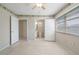 Bedroom with ceiling fan featuring doors to the bathroom and closet at 5521 Riverbluff Cir # V-10, Sarasota, FL 34231