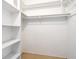 Spacious walk-in closet features built-in shelves and ample storage space at 5521 Riverbluff Cir # V-10, Sarasota, FL 34231