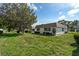Lush green lawn with mature trees at 5521 Riverbluff Cir # V-10, Sarasota, FL 34231