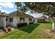 Well-maintained exterior with lush lawn and blooming shrubs at 5521 Riverbluff Cir # V-10, Sarasota, FL 34231