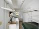 Bright laundry room with ample shelving, washer, and dryer at 5521 Riverbluff Cir # V-10, Sarasota, FL 34231