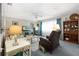 Inviting living room with comfortable seating, TV, and beautiful decor at 5521 Riverbluff Cir # V-10, Sarasota, FL 34231