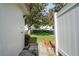 Landscaped side yard with a fenced area, creating a private outdoor space at 5521 Riverbluff Cir # V-10, Sarasota, FL 34231
