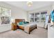 Well-lit bedroom with a large window and a comfortable bed with a wooden frame at 5740 Sunflower Cir, Sarasota, FL 34238