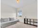 Carpeted bedroom featuring a neutral color palette, complemented by an ample window at 5740 Sunflower Cir, Sarasota, FL 34238