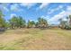 Community dog park with a covered seating area and plenty of space for furry friends to play and socialize at 5740 Sunflower Cir, Sarasota, FL 34238
