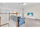 Upstairs living area featuring a comfortable sofa, and a white media center at 5740 Sunflower Cir, Sarasota, FL 34238