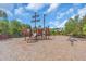 Community playground featuring a pirate-themed play structure, slide and spring rider at 5740 Sunflower Cir, Sarasota, FL 34238