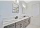 This modern bathroom features black fixtures, a floating vanity, and sleek design at 5939 Redbay Blvd, Bradenton, FL 34210