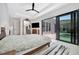 This bedroom features recessed ceilings, ceiling fan, and access to the pool through a glass sliding door at 5939 Redbay Blvd, Bradenton, FL 34210