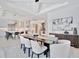 Open-concept design seamlessly connects the kitchen, dining, and living areas for modern living and entertaining at 5939 Redbay Blvd, Bradenton, FL 34210