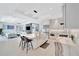 Open-concept kitchen with a large island, stainless steel appliances, and seamless flow into the living area at 5939 Redbay Blvd, Bradenton, FL 34210