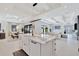 Well-lit kitchen island with a farmhouse sink, offering ample counter space and seating, enhancing the modern living space at 5939 Redbay Blvd, Bradenton, FL 34210