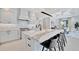 Bright kitchen features an expansive island, stainless steel appliances, and an open layout for modern living at 5939 Redbay Blvd, Bradenton, FL 34210