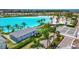 Aerial view of a large lagoon area with palm trees and a building near the parking lot at 5939 Redbay Blvd, Bradenton, FL 34210