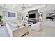 Modern living room with fireplace, stylish decor, and an open layout, creating a welcoming and comfortable space at 5939 Redbay Blvd, Bradenton, FL 34210