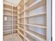 Spacious walk-in pantry with ample shelving for optimal organization and storage at 5939 Redbay Blvd, Bradenton, FL 34210