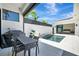 Outdoor patio featuring a modern pool, stylish patio furniture, and view to the bedroom with sliding glass doors at 5939 Redbay Blvd, Bradenton, FL 34210