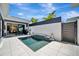 Backyard pool area with stylish design, tropical landscaping, and clear views of the house from the outdoor space at 5939 Redbay Blvd, Bradenton, FL 34210