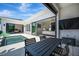Backyard pool and patio area with outdoor seating, grill, and views of the home's modern design and layout at 5939 Redbay Blvd, Bradenton, FL 34210