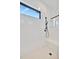 This shower features a built-in bench, black fixtures and a modern design at 5939 Redbay Blvd, Bradenton, FL 34210