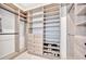Well-organized walk-in closet with shelving, drawers, and hanging rods for efficient storage and convenience at 5939 Redbay Blvd, Bradenton, FL 34210