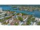 Beautiful aerial view showcasing waterfront condos in a lush, landscaped community with convenient parking at 6157 Midnight Pass Rd # B42, Sarasota, FL 34242