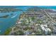 Gorgeous aerial shot of a waterfront condo complex with access to a dock on the beautiful channel at 6157 Midnight Pass Rd # B42, Sarasota, FL 34242