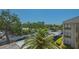 Aerial view showcasing the building and palm trees at 6157 Midnight Pass Rd # B42, Sarasota, FL 34242