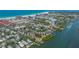 Gorgeous aerial view of waterfront condos nestled near pristine beaches, providing a tranquil and desirable location at 6157 Midnight Pass Rd # B42, Sarasota, FL 34242