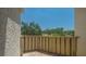 Private balcony with lush green trees and blue sky at 6157 Midnight Pass Rd # B42, Sarasota, FL 34242
