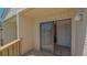 Cozy balcony with a sliding glass door leading to the living space at 6157 Midnight Pass Rd # B42, Sarasota, FL 34242