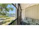 Relax on this waterfront balcony with seating and breathtaking views of the serene water and lush greenery at 6157 Midnight Pass Rd # B42, Sarasota, FL 34242