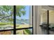 Breathtaking waterfront views from the condo window with a peek at the screened-in balcony with bistro table at 6157 Midnight Pass Rd # B42, Sarasota, FL 34242
