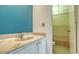Charming bathroom features a marble countertop vanity and a shower with a curtain at 6157 Midnight Pass Rd # B42, Sarasota, FL 34242