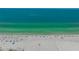 Scenic beach view of expansive shoreline, soft sand, and crystal-clear turquoise waters at 6157 Midnight Pass Rd # B42, Sarasota, FL 34242