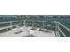 Exterior waterfront dock featuring comfortable seating and stunning views for residents' enjoyment at 6157 Midnight Pass Rd # B42, Sarasota, FL 34242