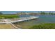 Scenic view of private dock leading out to calm waters, perfect for boating and fishing at 6157 Midnight Pass Rd # B42, Sarasota, FL 34242