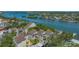 Waterfront condos featuring a picturesque dock along a calm channel perfect for boating and recreation at 6157 Midnight Pass Rd # B42, Sarasota, FL 34242