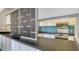 View into the kitchen from the dining area highlighting the countertops and backsplash at 6157 Midnight Pass Rd # B42, Sarasota, FL 34242