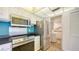 Modern kitchen featuring stainless steel appliances, sleek countertops, and ample cabinet space at 6157 Midnight Pass Rd # B42, Sarasota, FL 34242