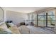 Cozy living room with scenic water views, comfortable furnishings, and access to a screened-in balcony at 6157 Midnight Pass Rd # B42, Sarasota, FL 34242