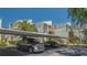 Exterior view of the building and a covered parking area at 6157 Midnight Pass Rd # B42, Sarasota, FL 34242