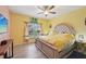 Relaxing bedroom with a tufted headboard, neutral color palette, and lots of natural light at 6330 Green Oak Cir, Bradenton, FL 34203