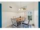 Bright dining area with a view and a wooden table with chairs at 6330 Green Oak Cir, Bradenton, FL 34203