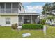 Exterior view of the home featuring a screened-in lanai with ceiling fan and ample seating at 6330 Green Oak Cir, Bradenton, FL 34203