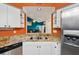 Kitchen with white cabinetry and granite counters at 6330 Green Oak Cir, Bradenton, FL 34203