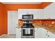 Efficient kitchen with stainless steel appliances and granite countertops at 6330 Green Oak Cir, Bradenton, FL 34203