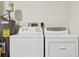 Laundry room features a washer, dryer, and water heater setup for convenience at 6330 Green Oak Cir, Bradenton, FL 34203